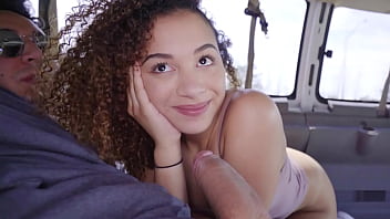 A beautiful and adorable black teenager gives a huge blowjob before receiving intense sex in a van